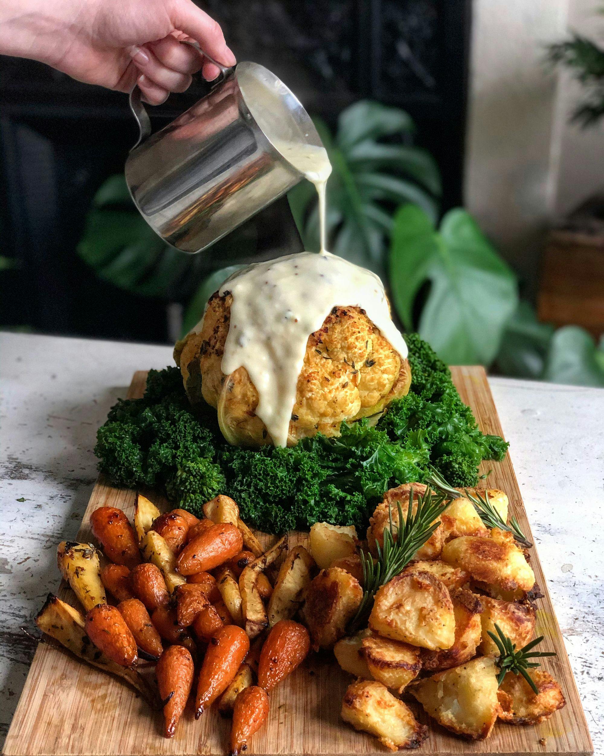 Whole Roasted Dijon, Thyme and Honey Cauliflower with a White Wine Cheese Sauce